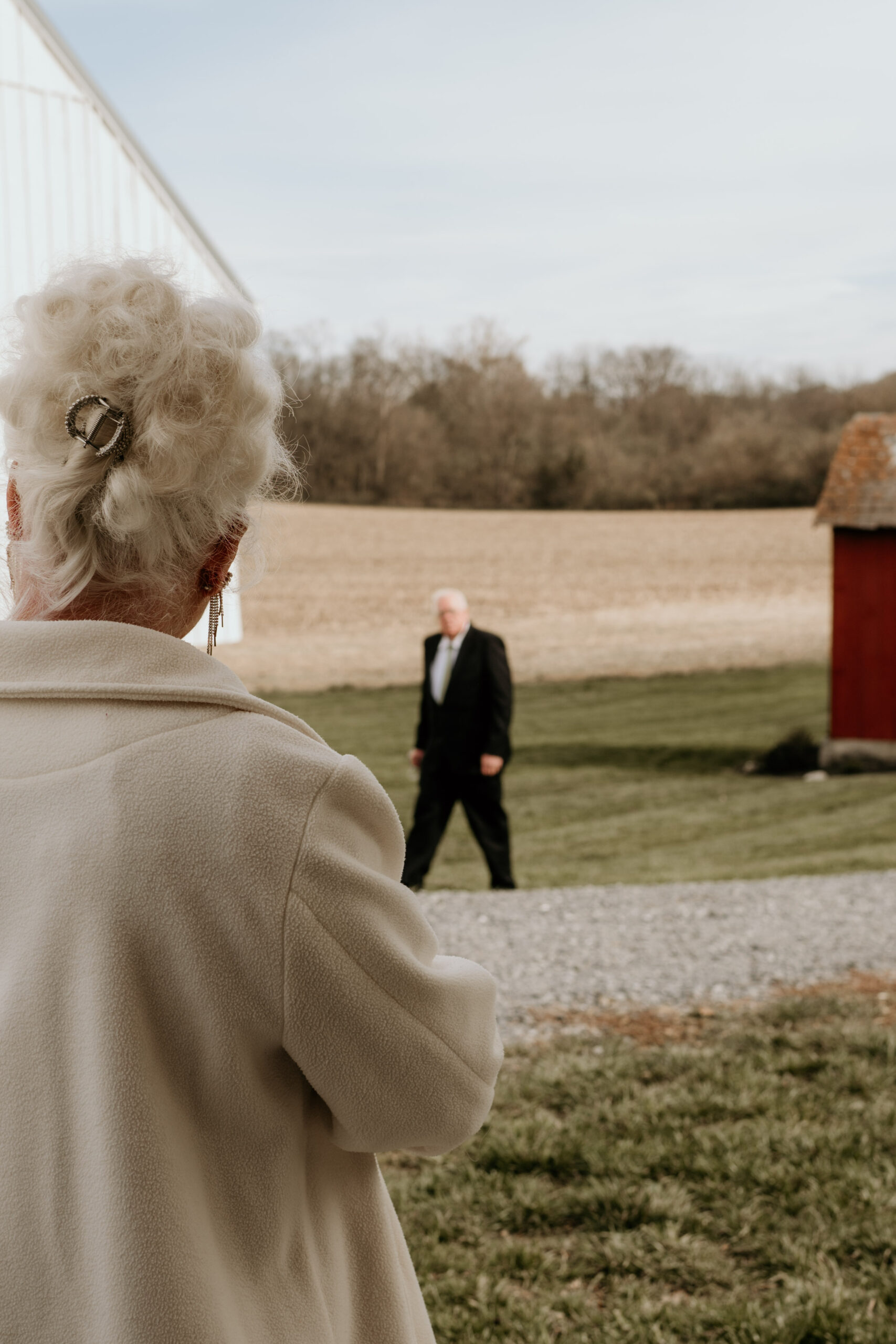 soft Moment of shared glances between a couple at their grand daughters wedding day