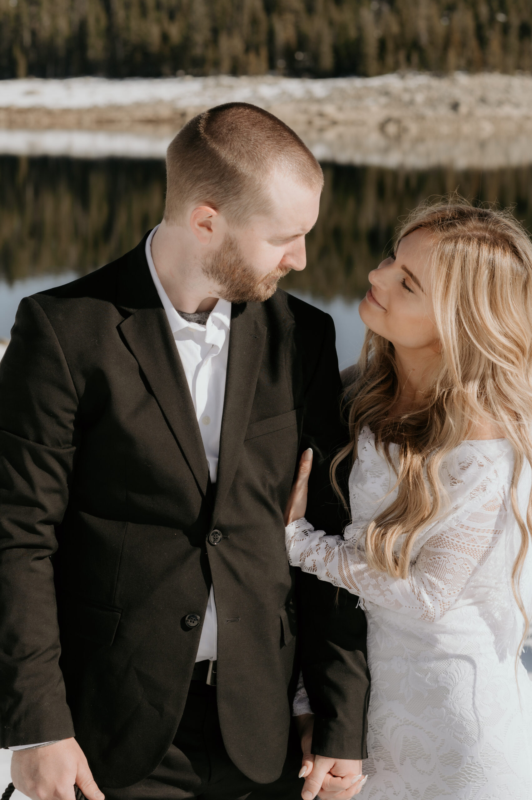 Couple embracing in snow at scenic Sierra Nevada location