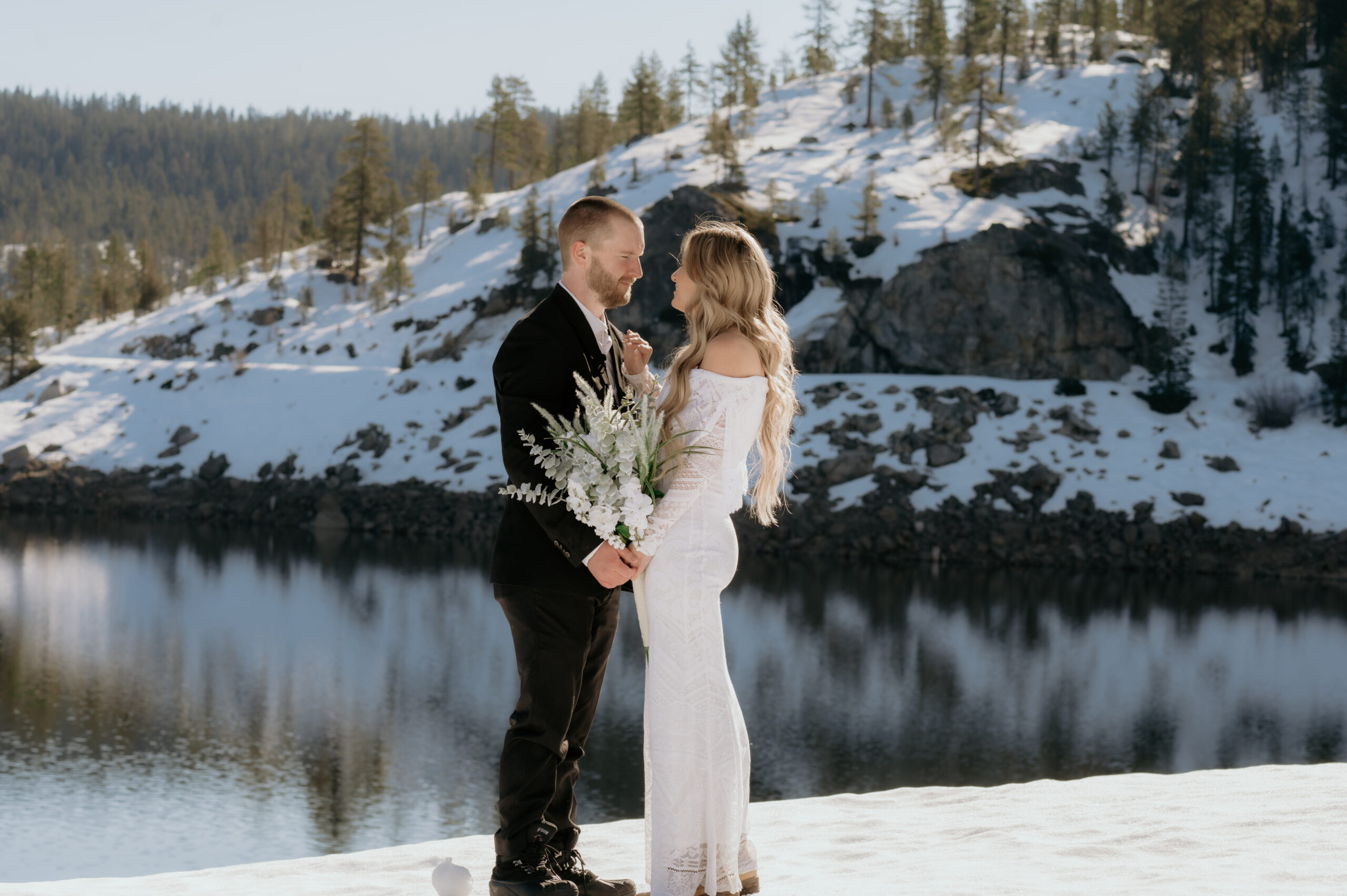 Bride and groom eloping in the snow-covered Sierra Mountains