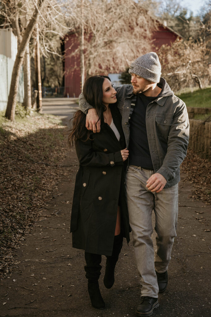 Couple strolling along a path in sutter creek for their couples session