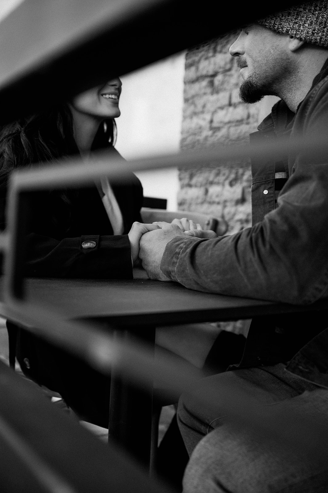 couple holding hands at a table in sutter creek