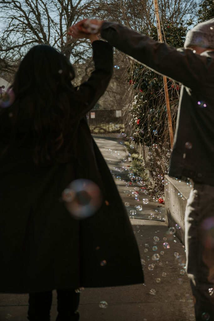 Couple Dancing in bubbles in downtown Sutter Creek during their couples photoshoot