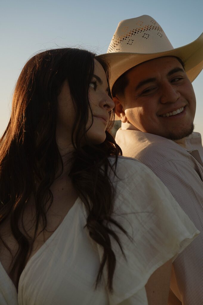 An engaged couple lean in for photos for their upcoming amador county wedding