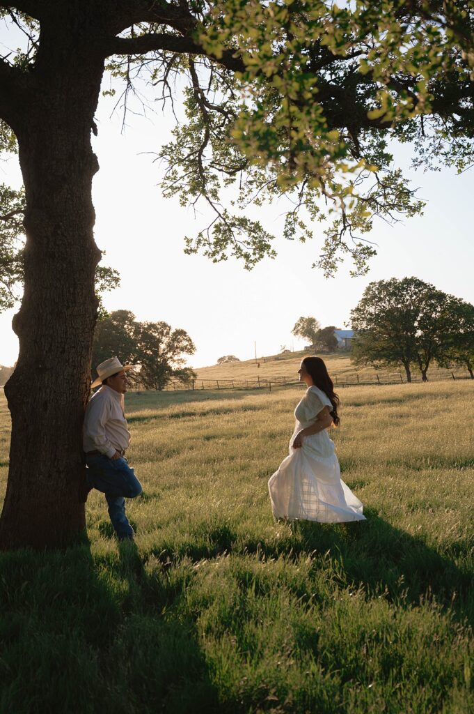 A california engagement photographer captures a newly engaged couple in a photo taken at golden hour 