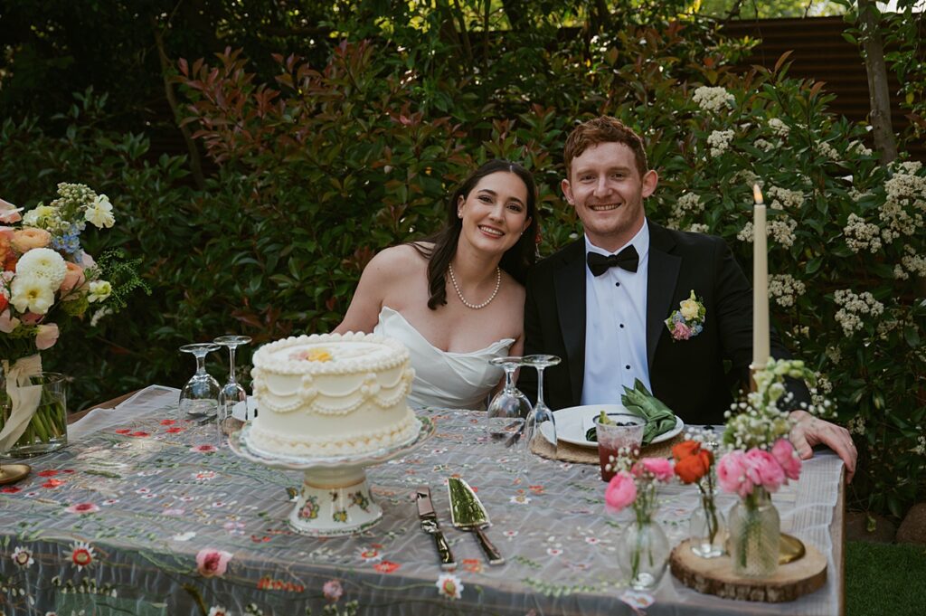 Newlyweds smile at their wedding reception at Hanford Garden