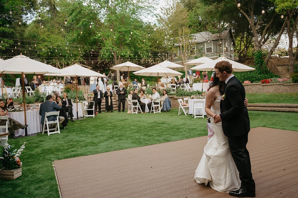 A bride and groom dance on the outdoor dance floor at Hanford Garden Sutter Creek 