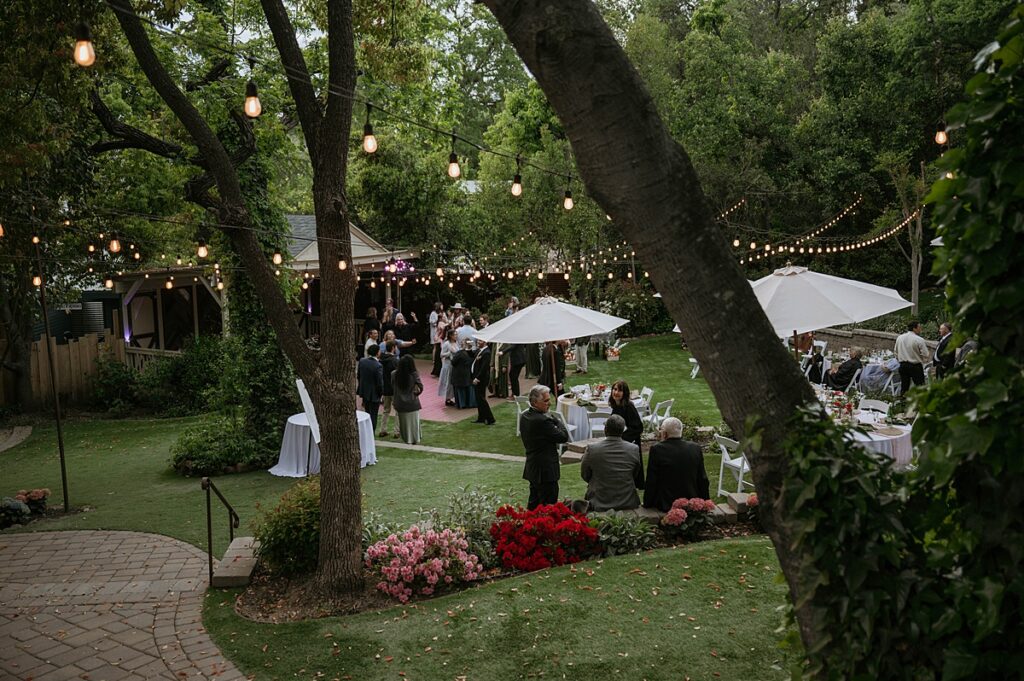 Guests mingle at an outdoor wedding reception at a sutter creek wedding venue in California 
