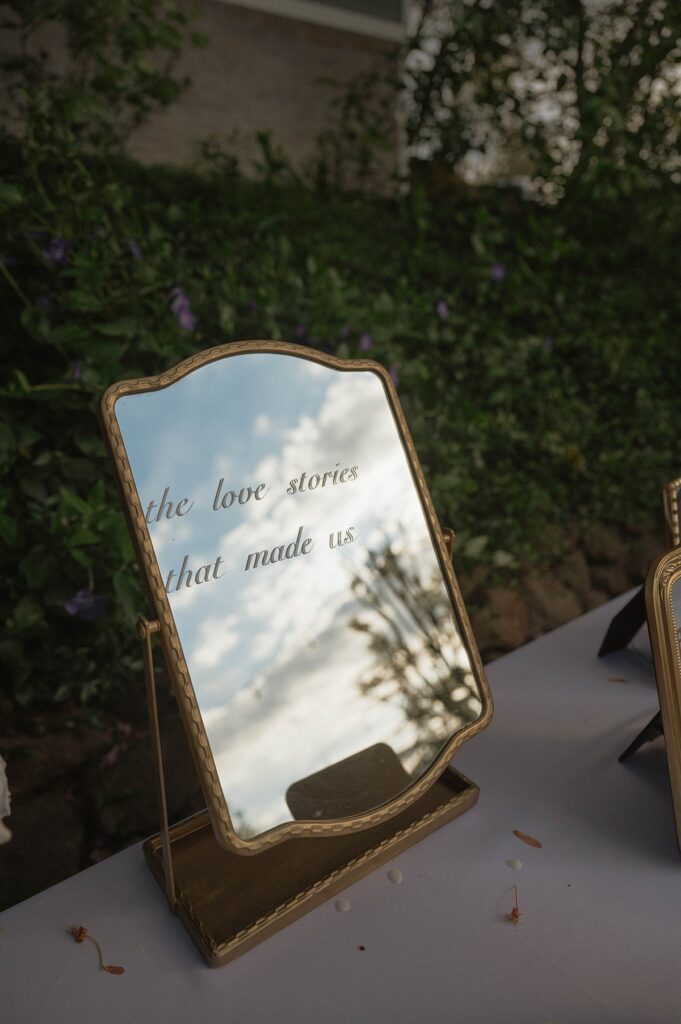 Wedding decor at a Sutter Creek wedding venue reads, 'the love stories that made us'