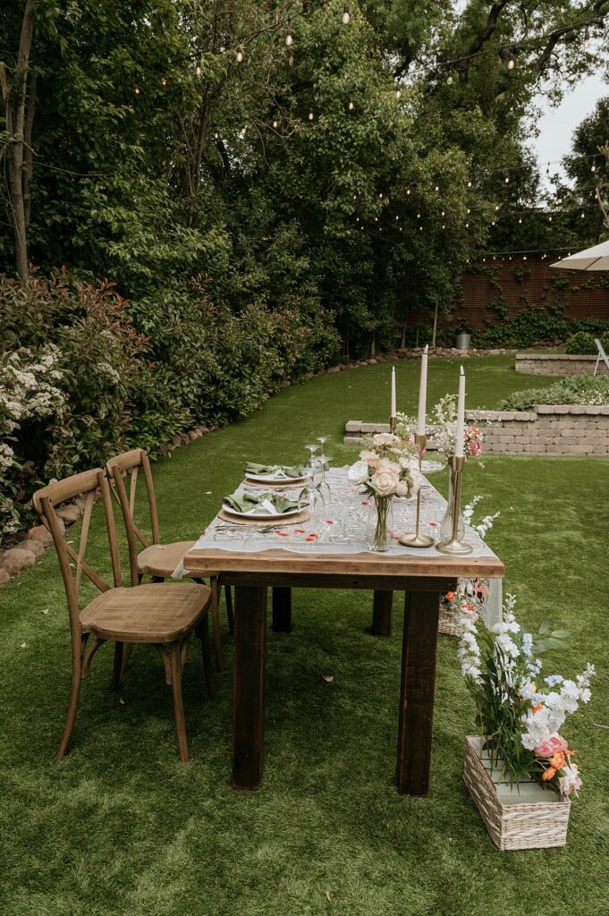 The bride & groom table set up is photographed before a Hanford Garden wedding reception