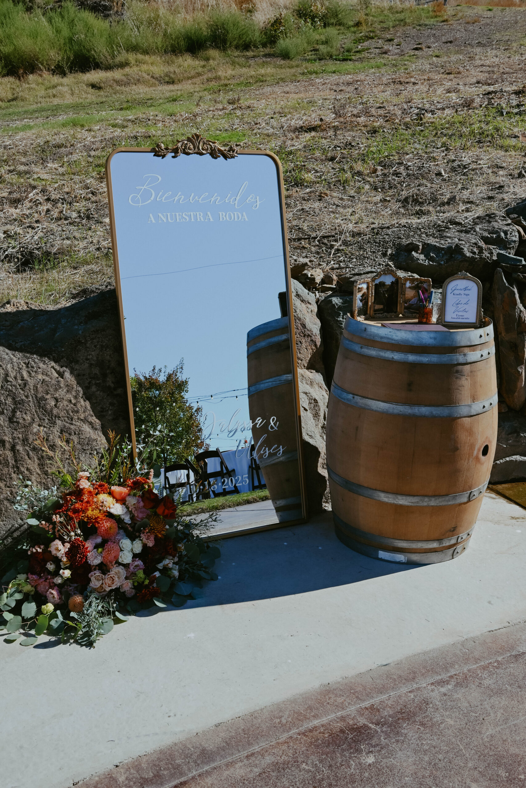 Wedding day details of a mirror and florals at Cazadd Cellars in Ione, California