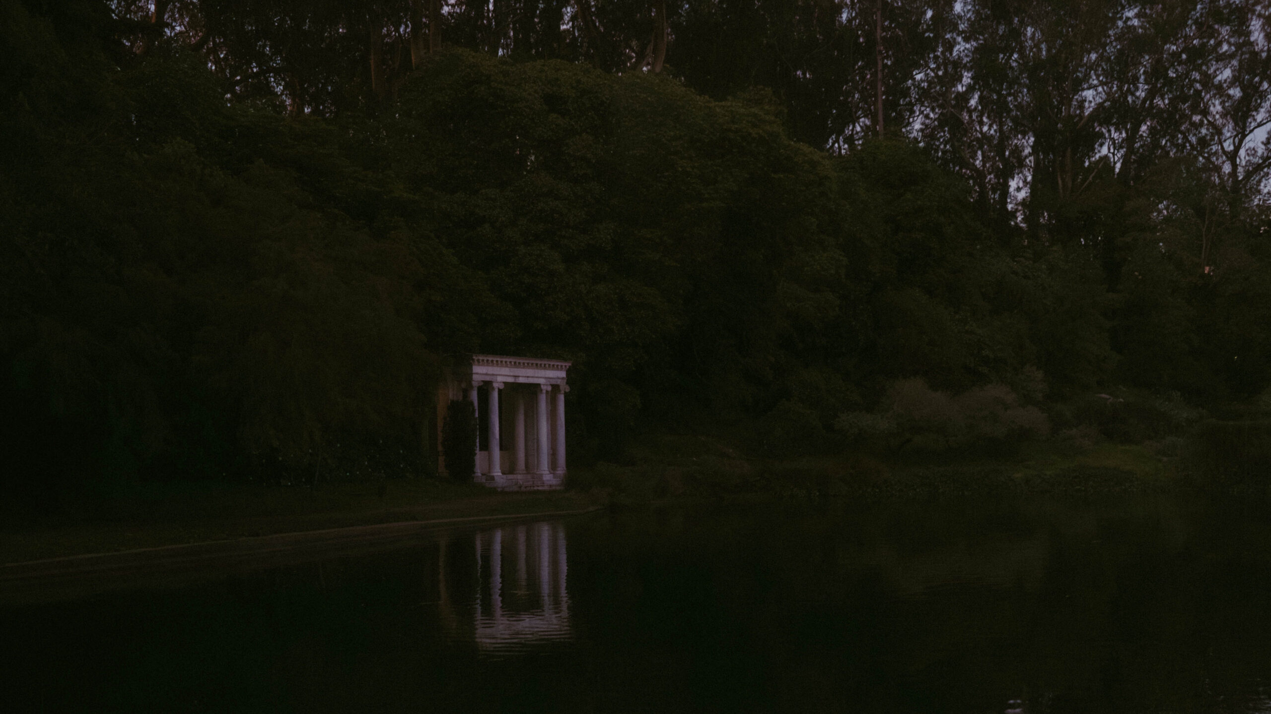 Reflection of the monument on the water shows Portals of the Past in San Francisco
