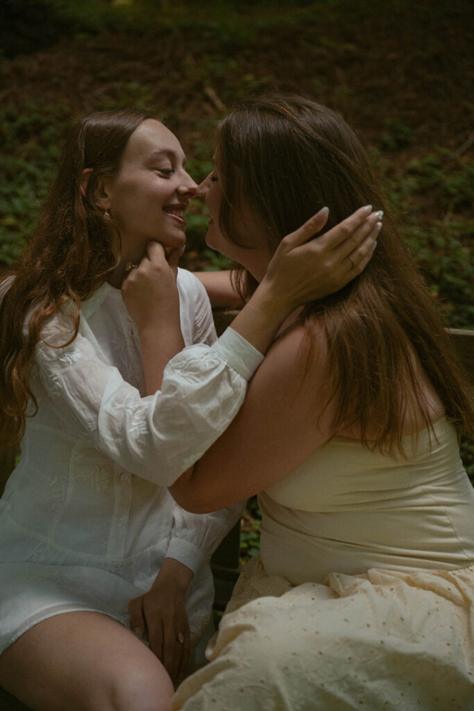 Emotional reaction moment captured during a surprise proposal in the redwoods